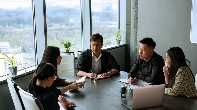 Corporate boardroom with floor-to-ceiling windows overlooking a city skyline